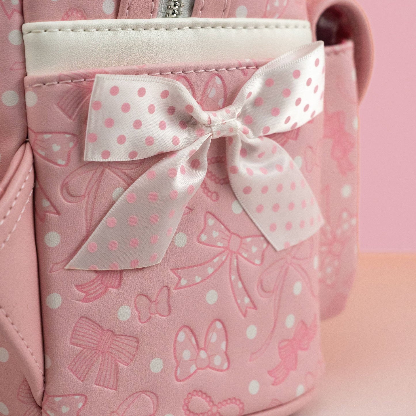 Loungefly x Disney Minnie Mouse Pink Debossed Bows Mini Backpack - GeekCore